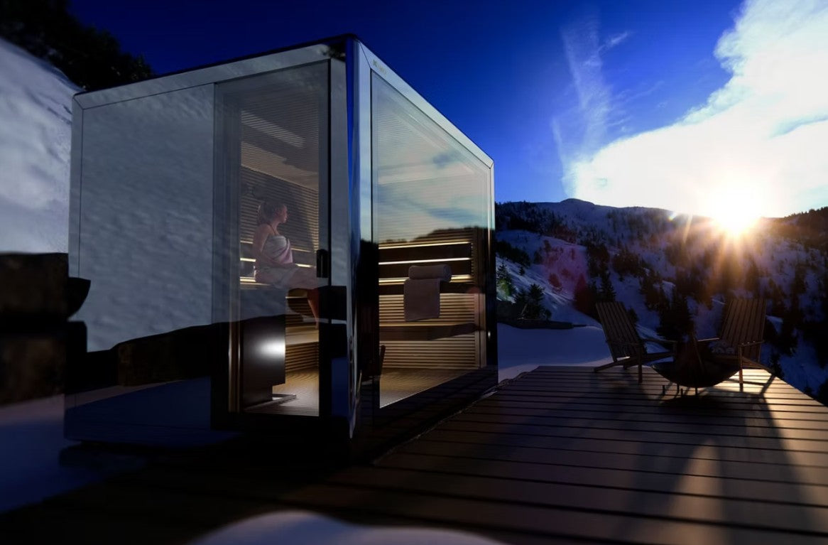 Modern glass Koya Cube Outdoor Traditional Sauna with mountain view during sunset