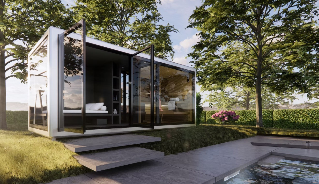 modular Koya Cube Outdoor Traditional Sauna with glass walls in a natural setting